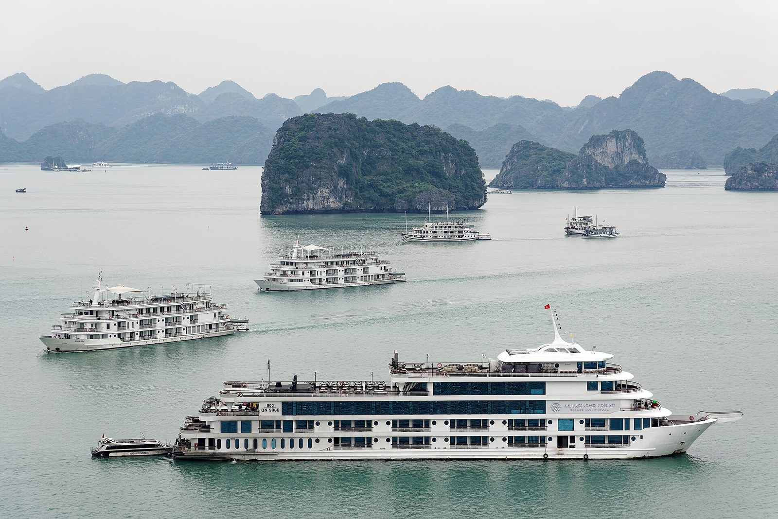 Cruise boats anchored among the limestone karsts of Ha Long Bay